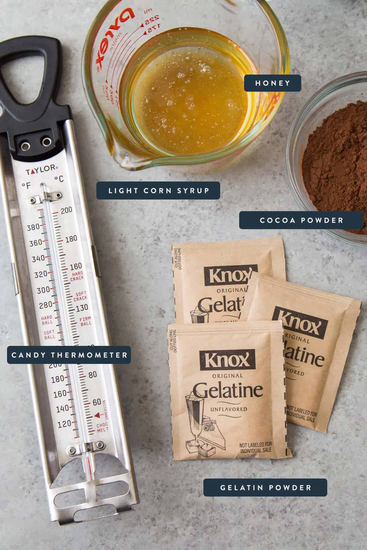 key tools and ingredients for chocolate marshmallow includes candy thermometer, gelatin powder, and light corn syrup.