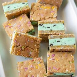 mint chocolate chip ice cream sugar cookie sandwiches arranged on serving platter.
