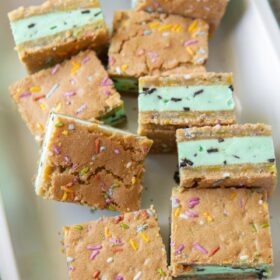 mint chocolate chip ice cream sugar cookie sandwiches arranged on serving platter.