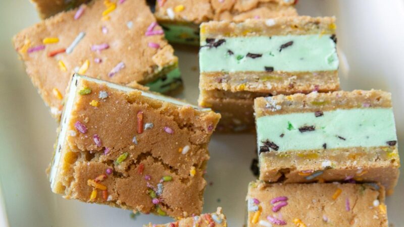 mint chocolate chip ice cream sugar cookie sandwiches arranged on serving platter.