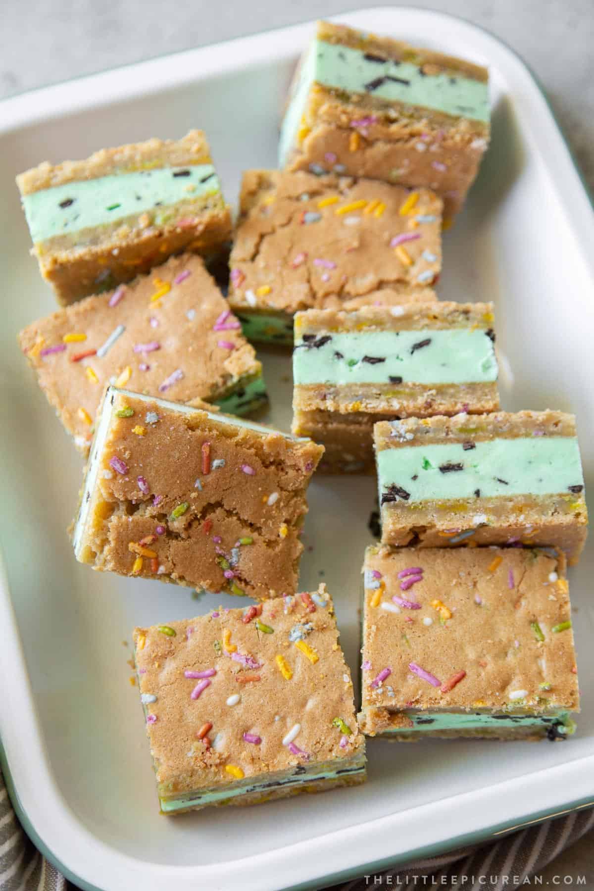 mint chocolate chip ice cream sugar cookie sandwiches arranged on serving platter.