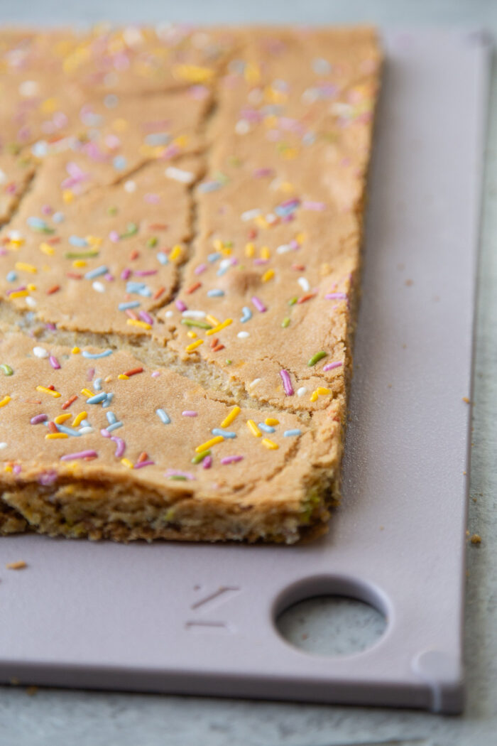 rainbow confetti sugar cookie baked in sheet tray for ice cream sandwiches.