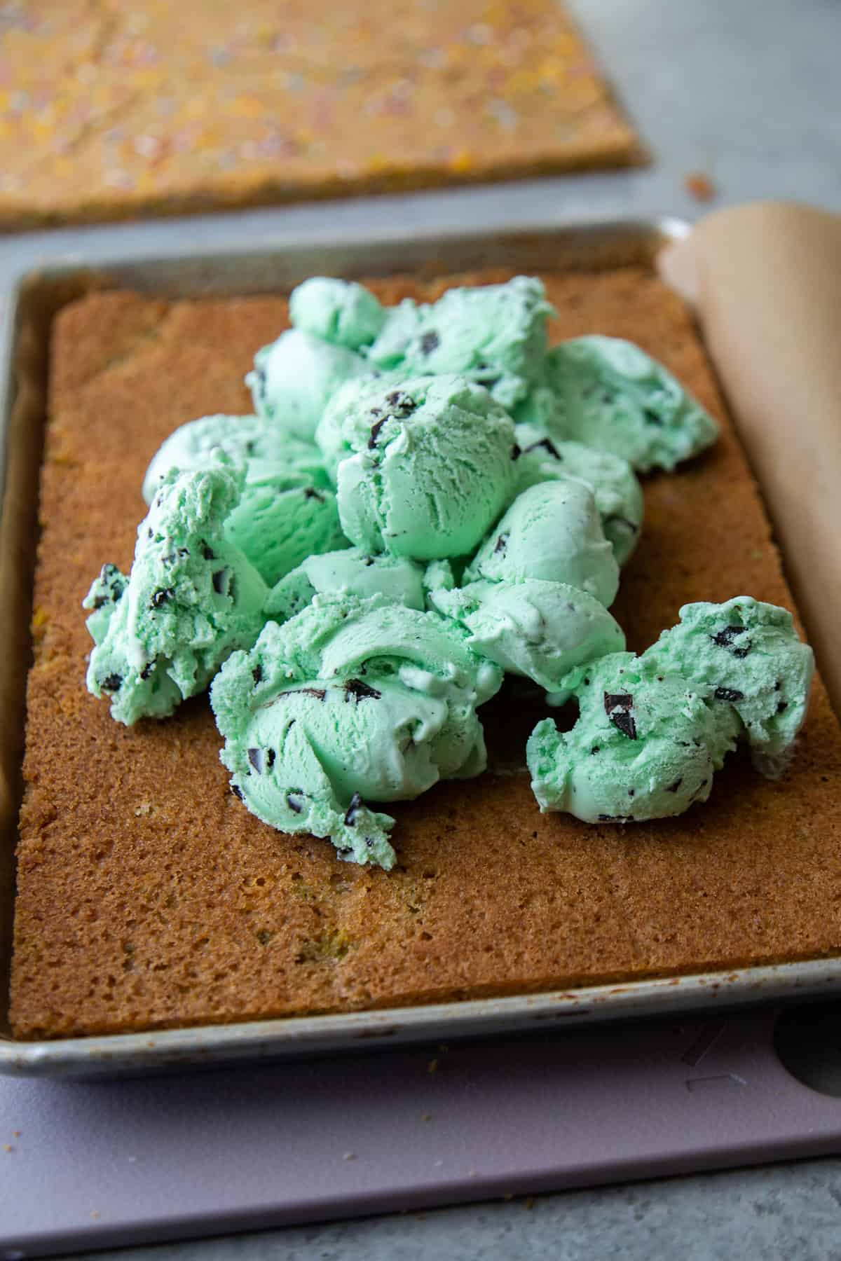 spread quart of ice cream over sugar cookie sheet.