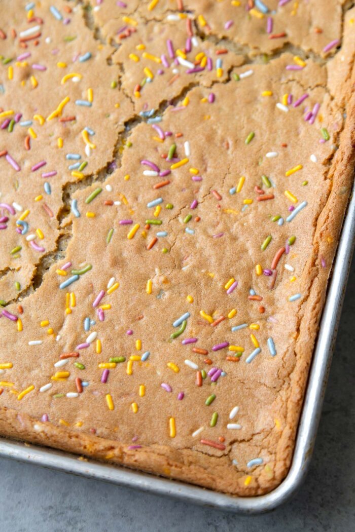 rainbow confetti sugar cookie baked in sheet tray for ice cream sandwiches.