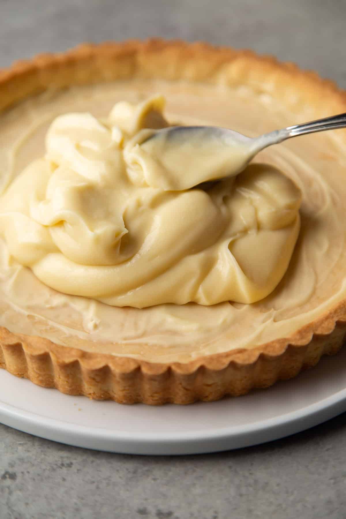 pastry cream spread into fully cooked tart shell.