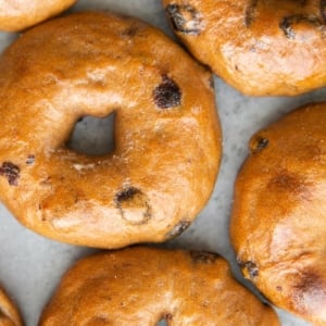 cinnamon raisin bagels arranged close together.