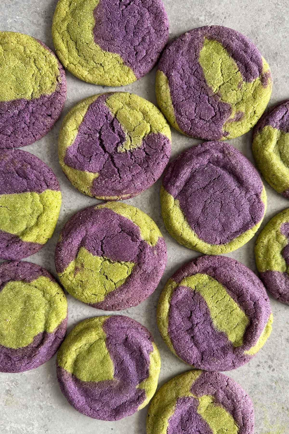 matcha ube marble sugar cookies arranged in one layer.