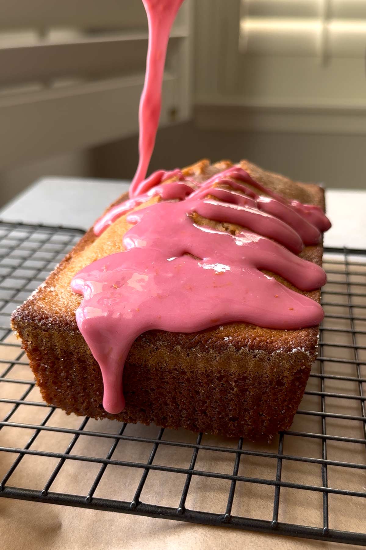 pour blood orange glaze over cooled blood orange pound cake loaf. 