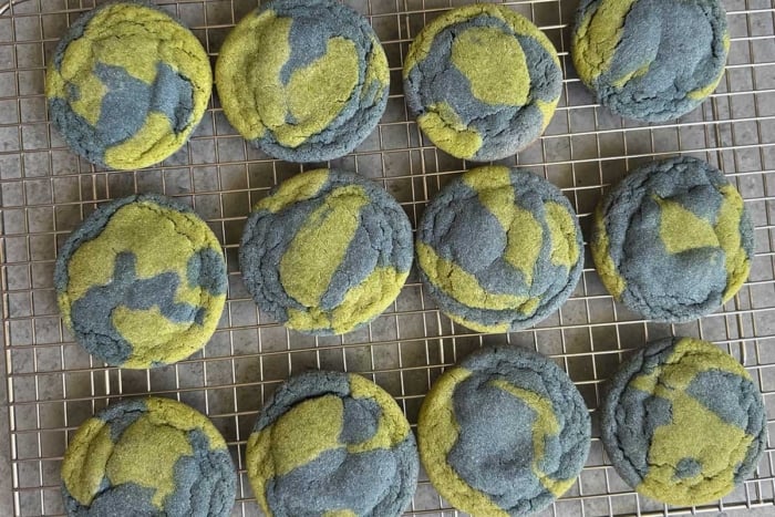 blue and green swirled cookies for Earth Day on wire rack.