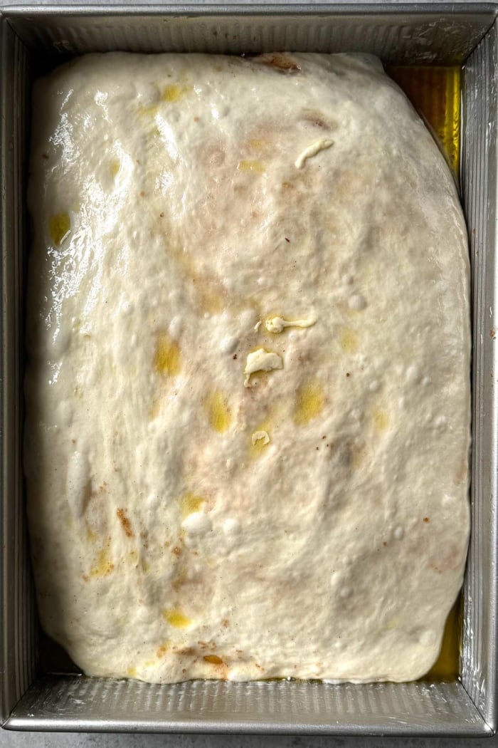 focaccia dough ready when fills out the entire baking pan.