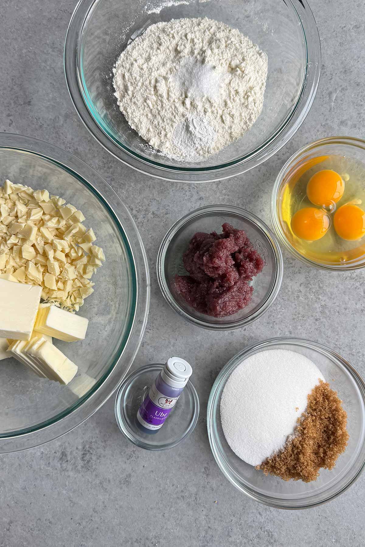 ingredients to make cake brownies portioned out in glass bowls.