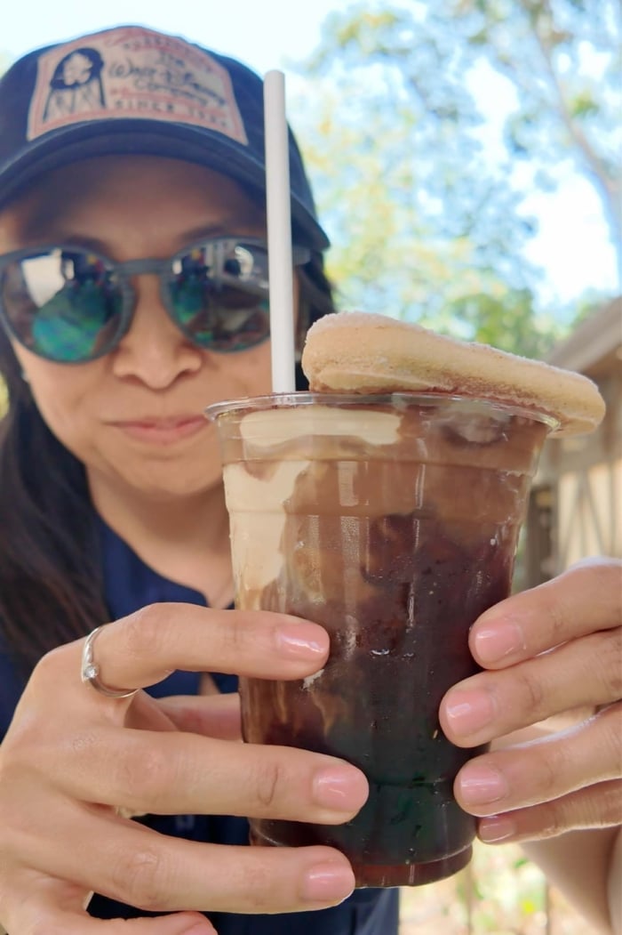 the little epicurean trying disneyland tiramisu cold brew coffee.