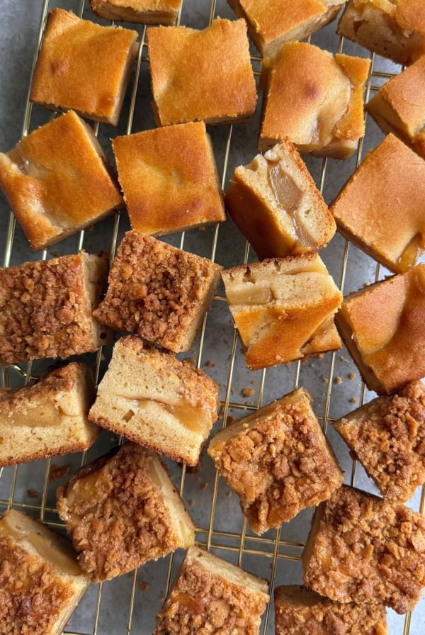 two versions of apple pie mochi butter cake on wire rack.