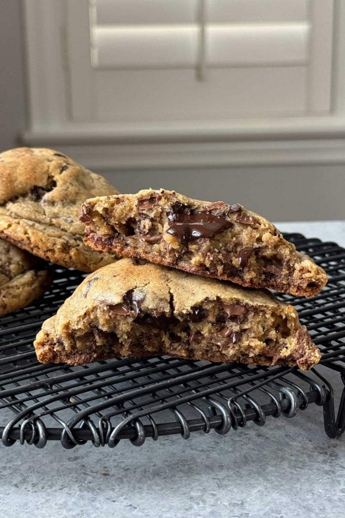 thick chocolate chunk cookie interior shot on black cooling rack.
