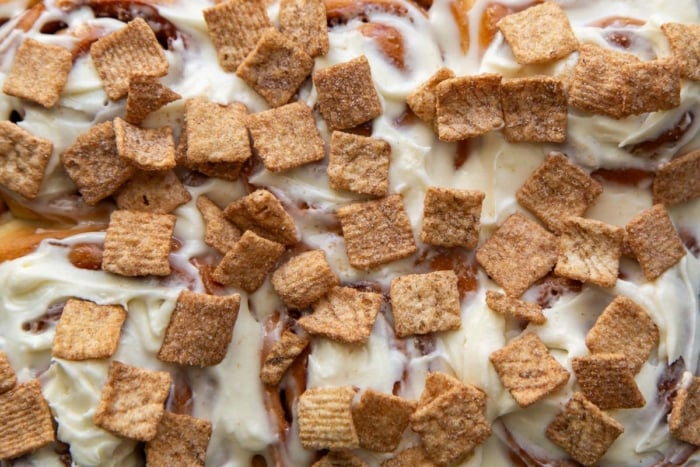 Cinnamon Toast Crunch cereal over cream cheese frosting.