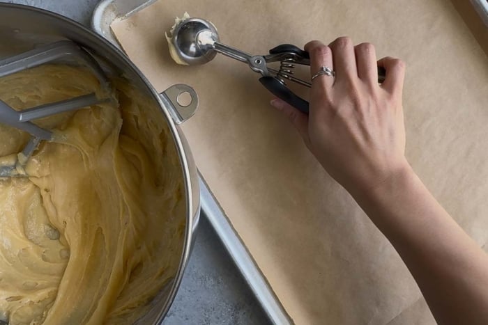 use a cookie scoop or disher to portion out choux pastry dough.