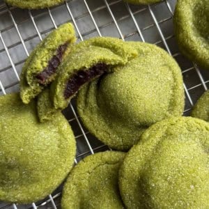 matcha red bean stuffed cookies on wire rack.