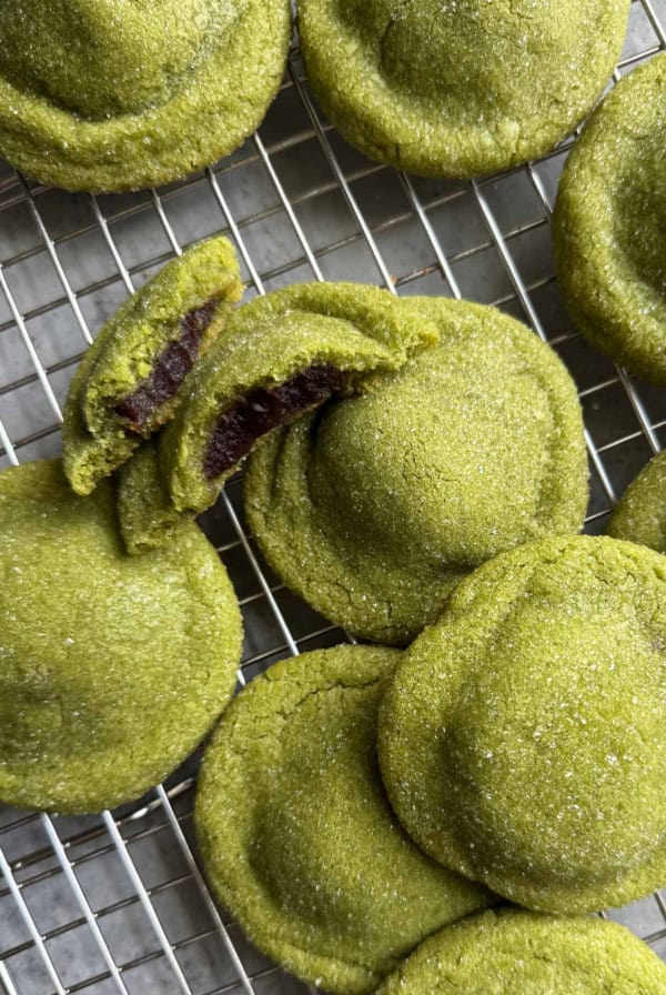matcha red bean stuffed cookies on wire rack.