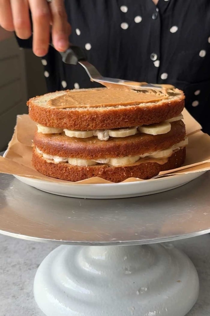 spread thin layer of peanut butter over cake layer.