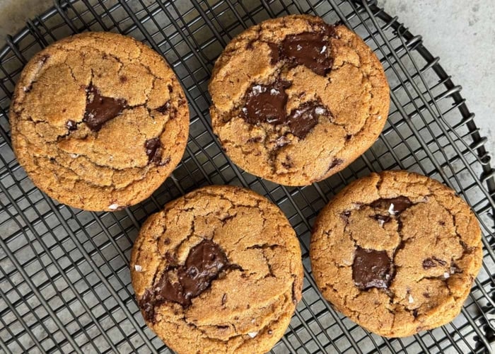 fresh baked chocolate chip cookies on wire rack.
