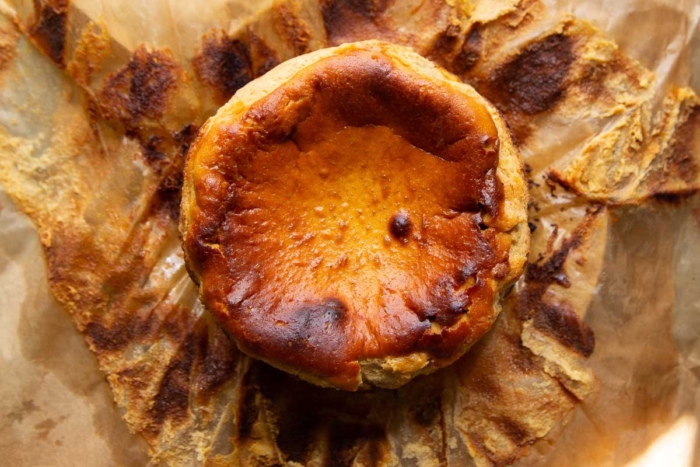Basque style pumpkin cheesecake on parchment paper.